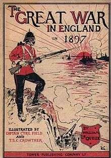 A British soldier, wearing a traditional red coat and holding a rifle with a fixed bayonet, is standing on the top of a cliff and looking out to sea, where a fleet of enemy warships is approaching. Meanwhile at the bottom of the cliff, a large gun fires at the approaching ships.