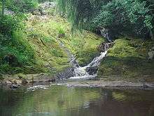 River cascading into small lake