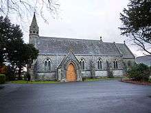 A small church with a lower chancel and an octagonal bell turret