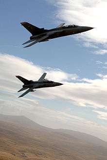 Photograph of two aeroplanes in flight.