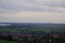 View over flat landscape with a patchwork of fields.