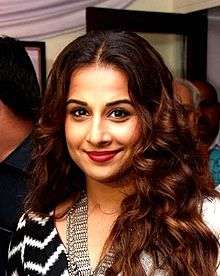 Vidya Balan is smiling at the camera