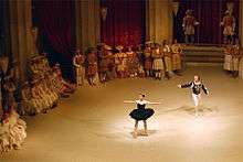 A photograph of a performance of Swan Lake during the third act, with the protagonist transformed into the Black Swan