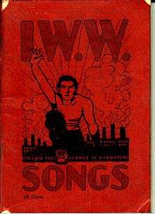 Booklet cover with large title, "IWW Songs", and illustration of a man climbing over a hill, reaching skyward, with factories in the background.