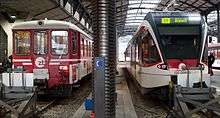 ZB trains at Lucerne, Stadler Spatz at right.